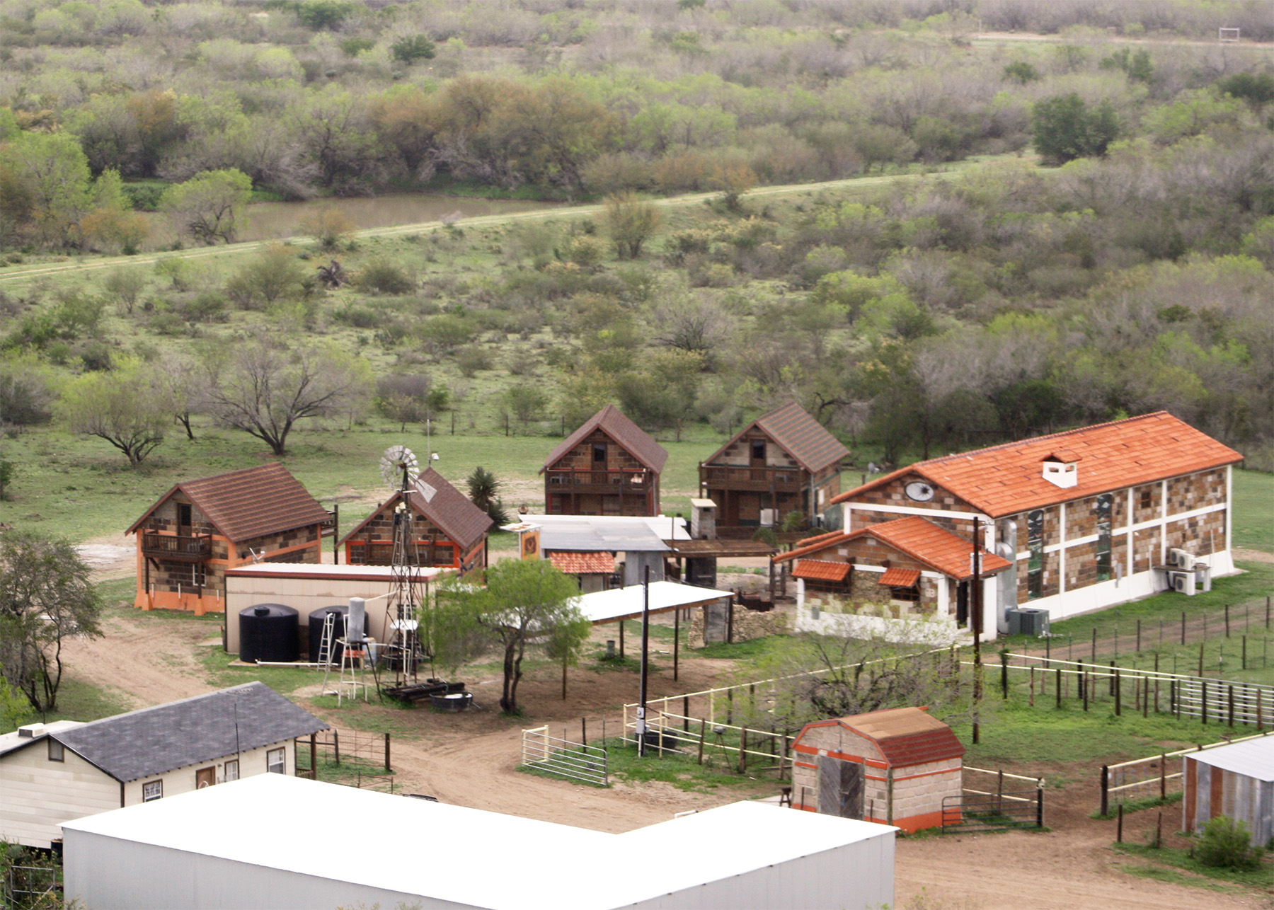 Aerial view of Las Lajas Ranch base camp showing lodges, cabins, and corrals in the South Texas brush country