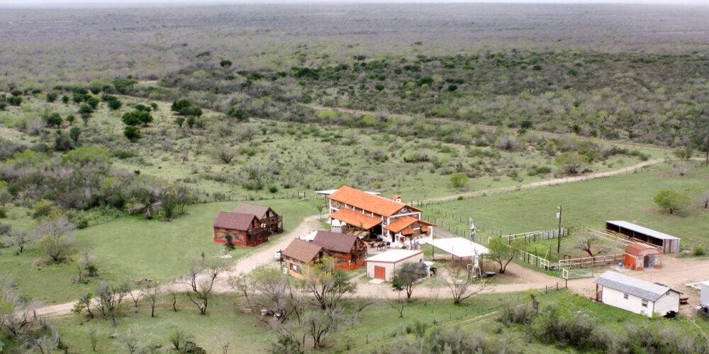 Aerial color photo of Las Lajas Ranch base camp buildings and grounds
