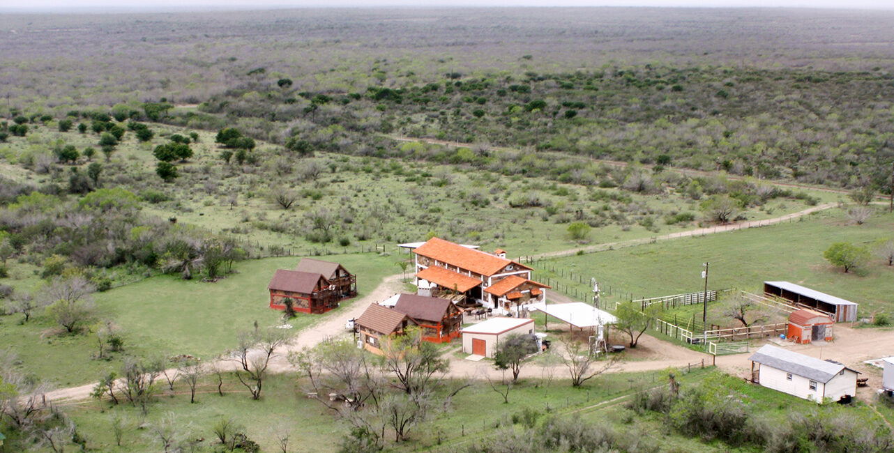 Aerial color photo of Las Lajas Ranch base camp buildings and grounds